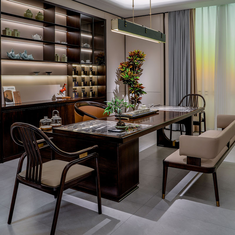 How does a marble tea table embody the philosophy of balancing strength and gentleness in home design?